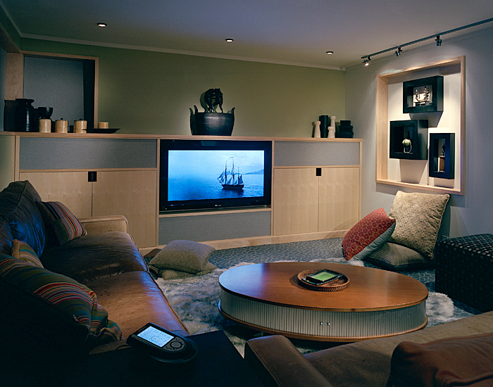 Murray Hill Townhouse living area features custom built-in storage and a round coffee table with informal seating.