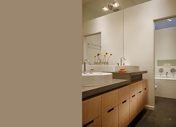 Modern bathroom vanity with wood paneling and vessel sinks in Madrona Live / Work project.
