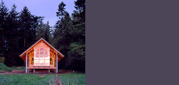 The Mount Vernon project features a small wooden cabin with a prominent front window in a forested setting.