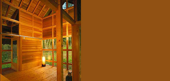 Mount Vernon features a wooden interior with exposed beams and large window walls overlooking the forest.