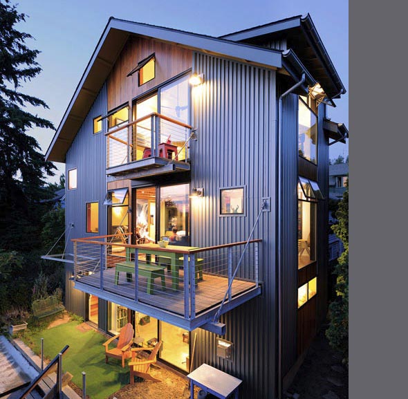 The Belyea-Faigin project by Johnston Architects is a modern house featuring metal siding and cantilevered balconies.
