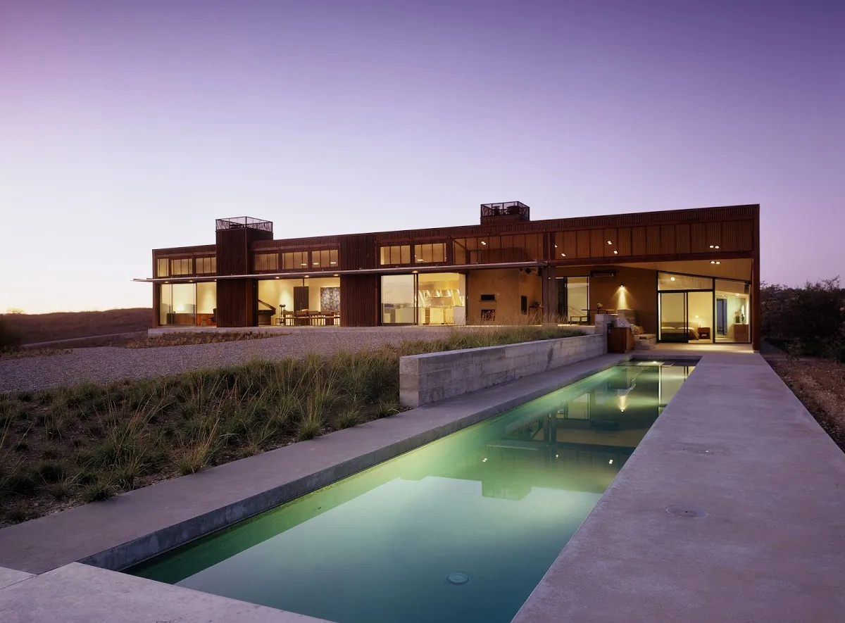 Santa Ynez Residence with U-shaped layout, flat roof sections, and a rectangular pool by Frederick Fisher and Partners Architects.
