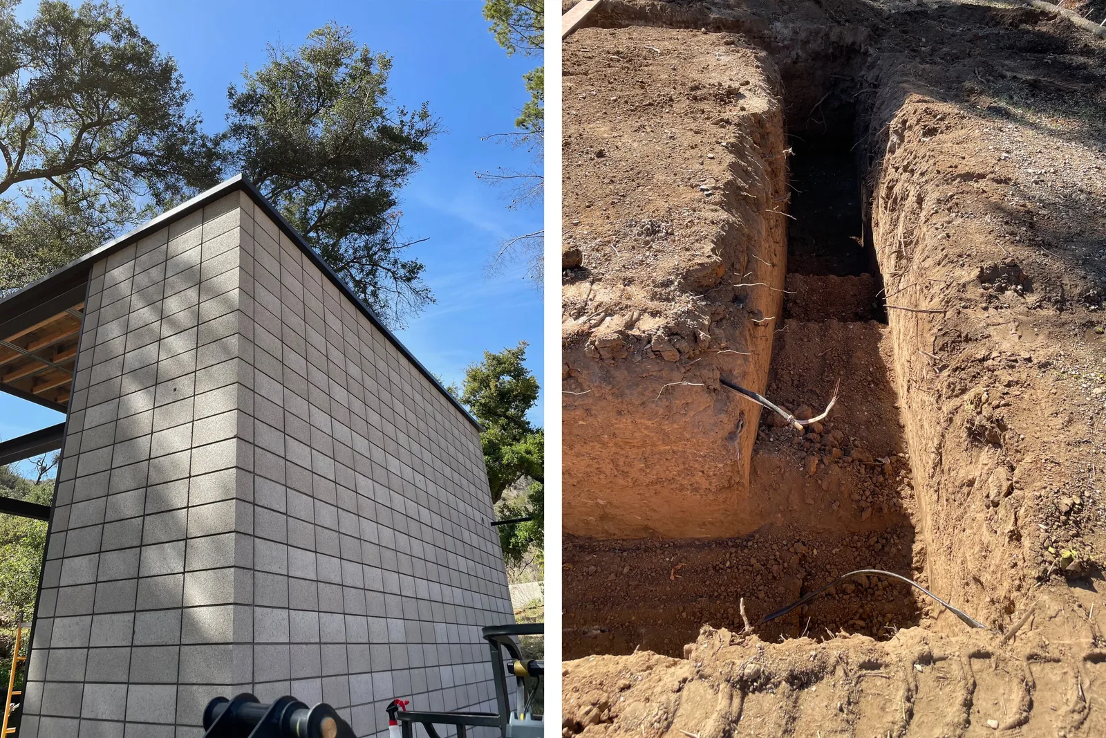 Concrete block wall exterior alongside an excavated trench at a construction site on a wooded lot.