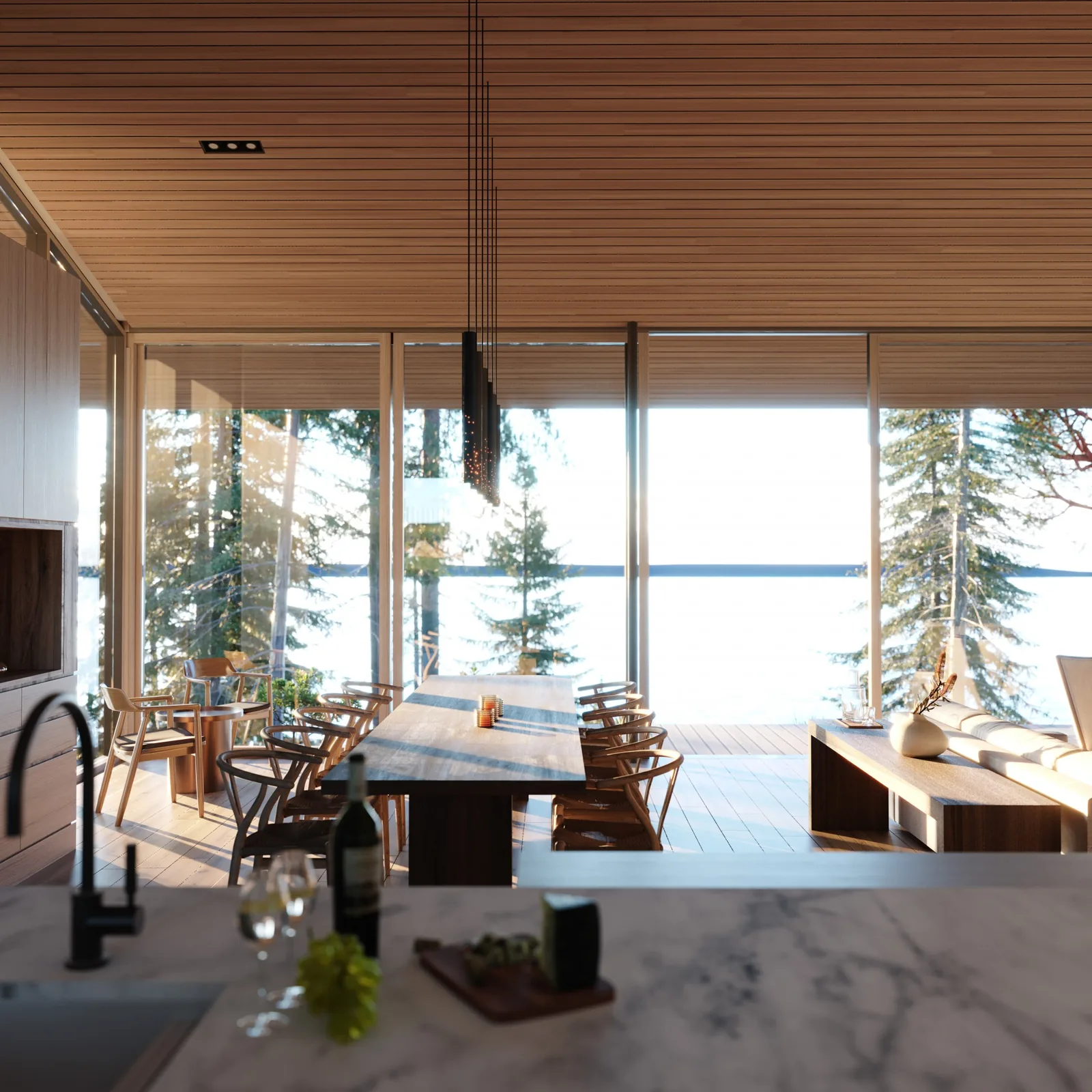 A dining room and living area feature floor-to-ceiling glazing with a view of trees and water beyond.