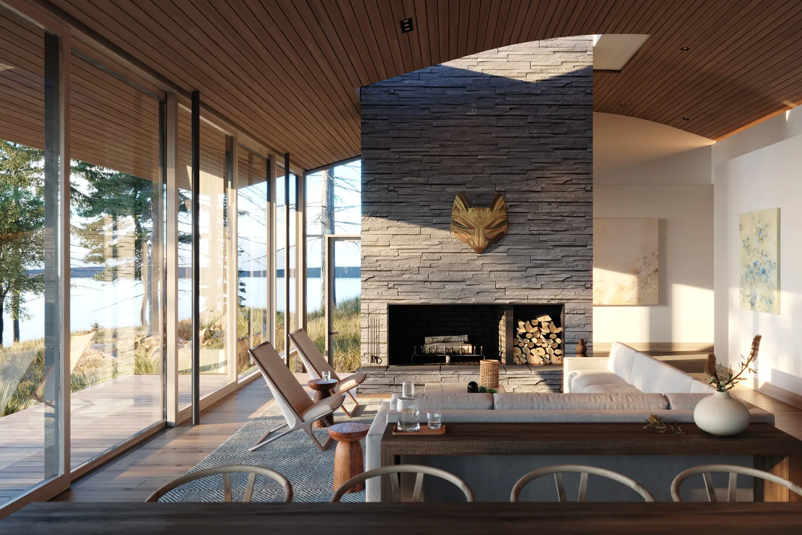 Living room with floor-to-ceiling windows and stone fireplace facing waterfront scenery.
