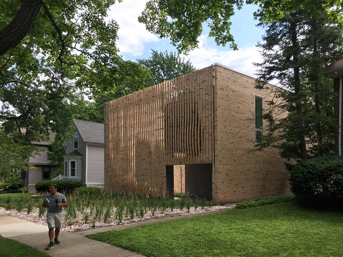 Lipton Thayer House features a cube-shaped brick facade with vertical brick slats creating texture and shadow play.