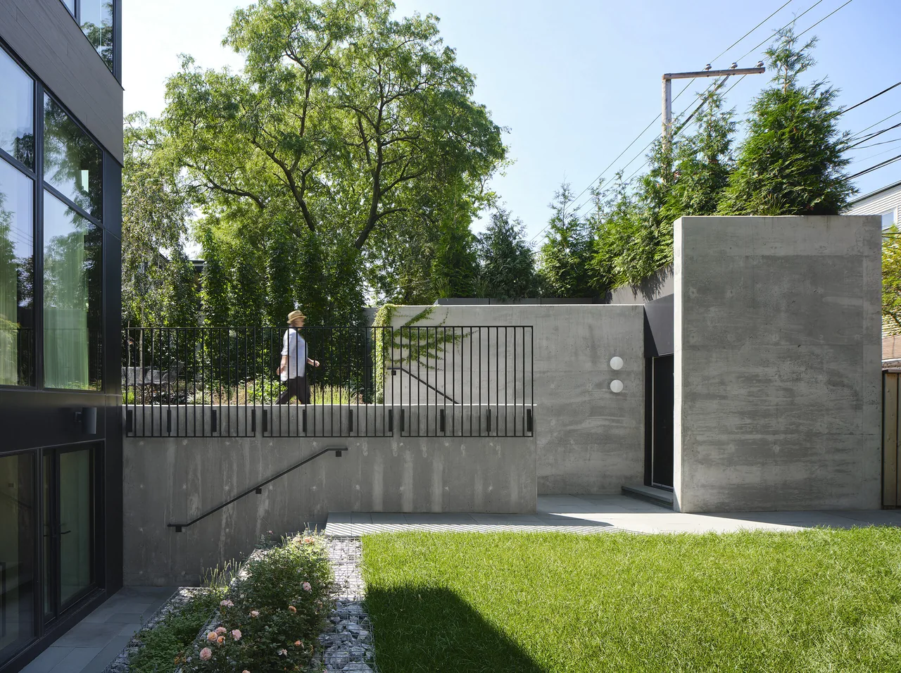 Concrete terrace with black metal railing and garden at Lakewood Balmoral Residence.