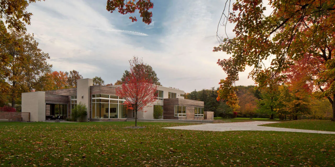 Exterior view of the Shaker Heights Residence showing a modern design with wood and glass elements.