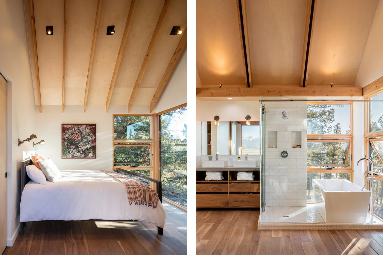 The bedroom and bathroom feature wood ceiling beams, large windows, and warm hardwood flooring.