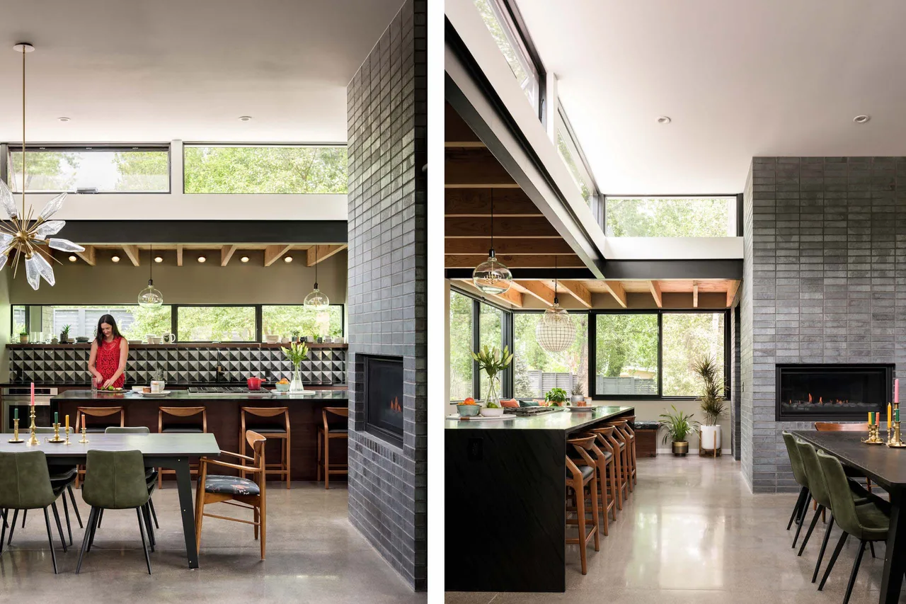 Mariposa Garden House kitchen and dining space showing a brick fireplace, wood-beamed ceiling, clerestory windows, and polished concrete floors.