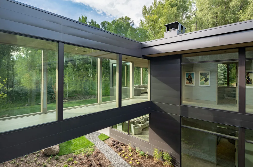Alpha 1 features a glass skybridge and extensive window walls showcasing contemporary design by Charles Cunniffe Architects.
