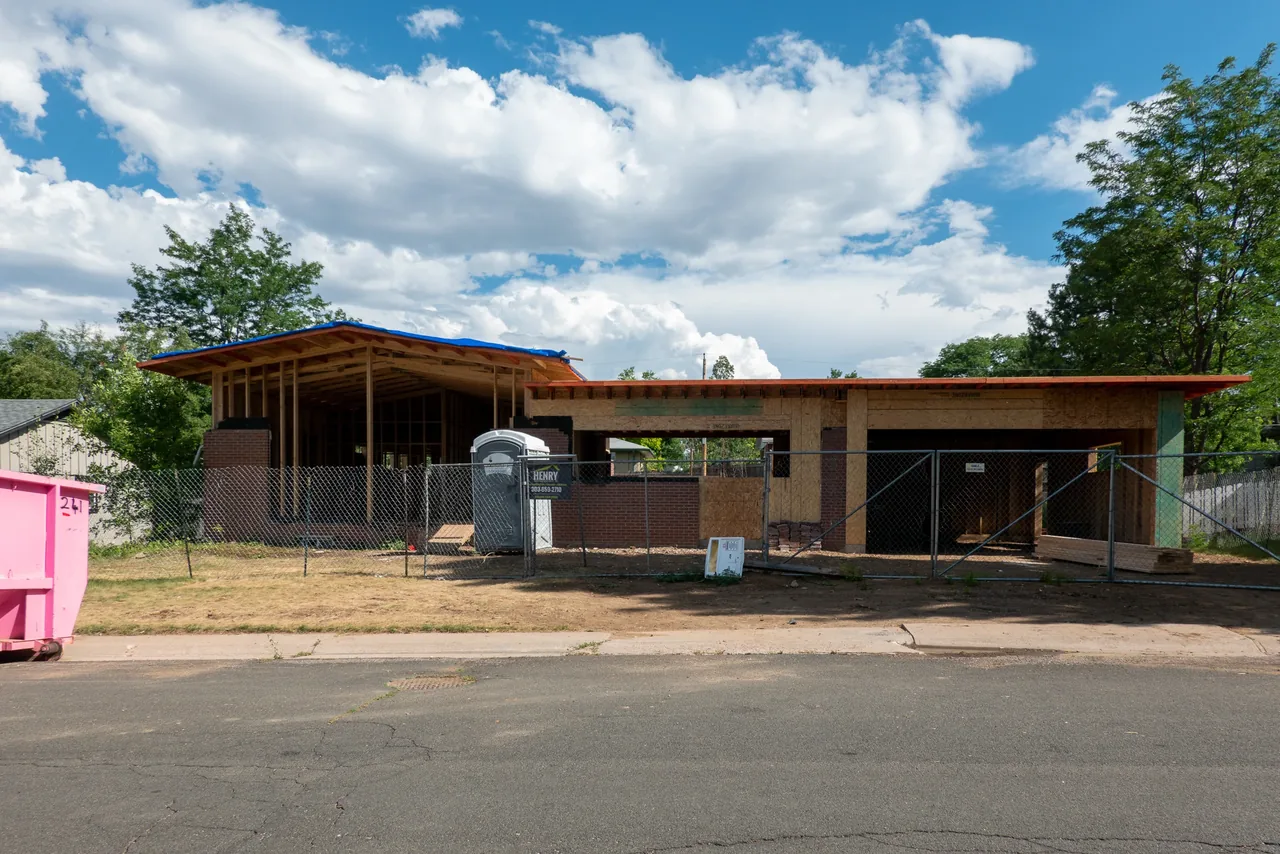 Centennial Modern Ranch by Cadence Studio is a single-story modern ranch home under construction with an attached two-car garage.