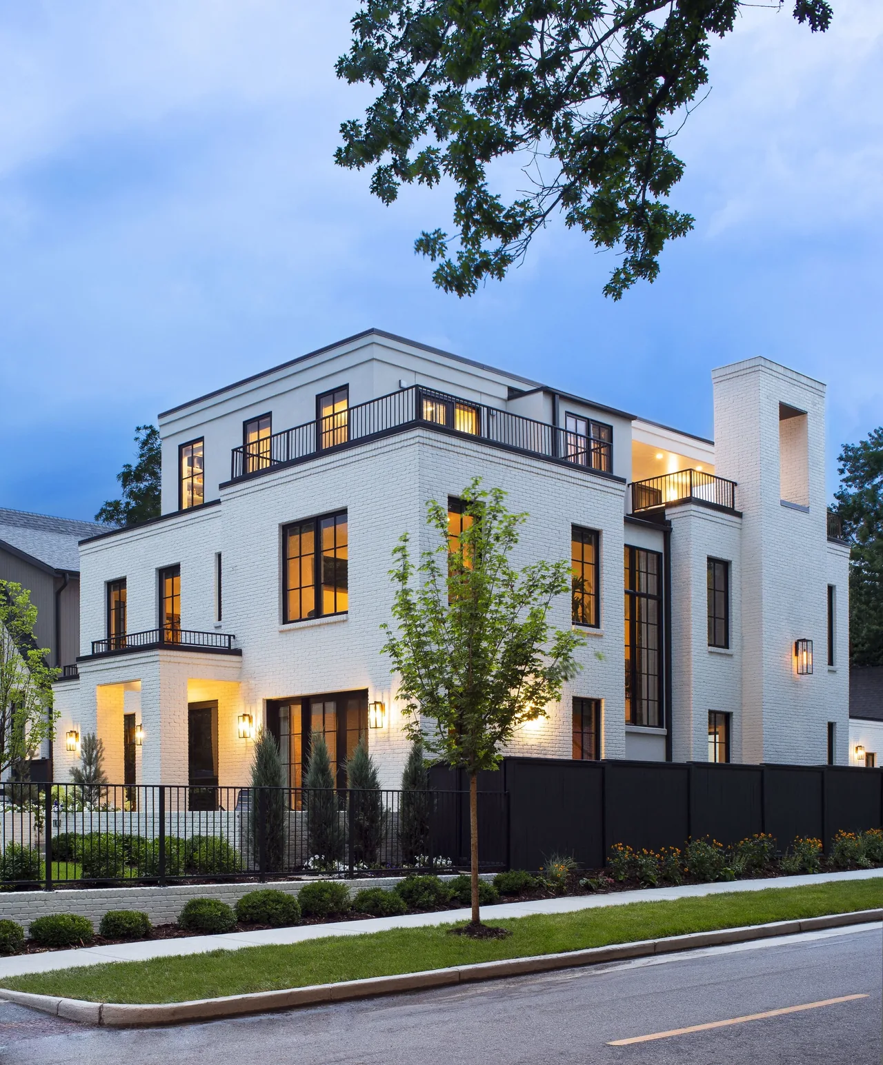 Denver Residence 12 features white brick and black metal railings with modern design elements.