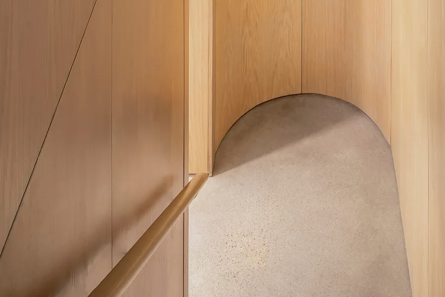 Grennoch Residence features curved wood paneling details from CONTENT Architecture.