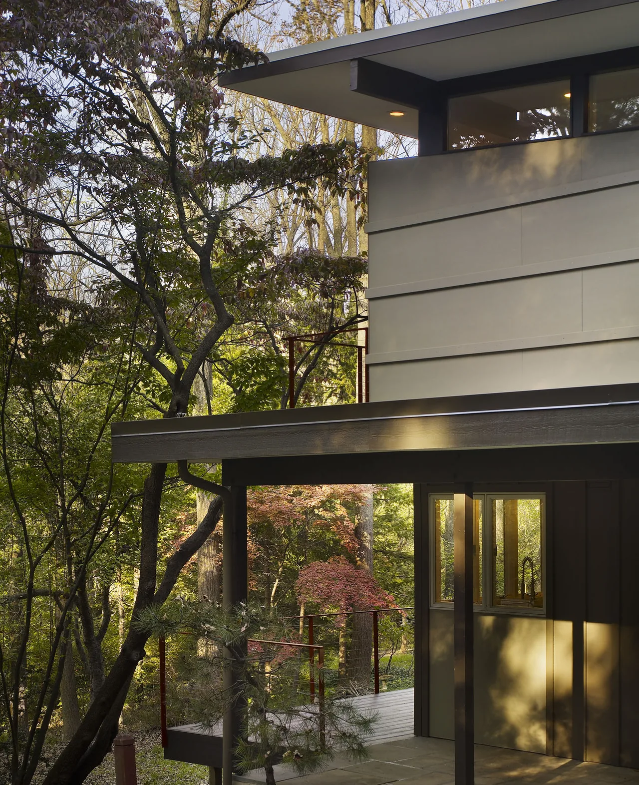 Seidenberg House renovations reveal a two-story structure with sloped metal roofs and clerestory windows.