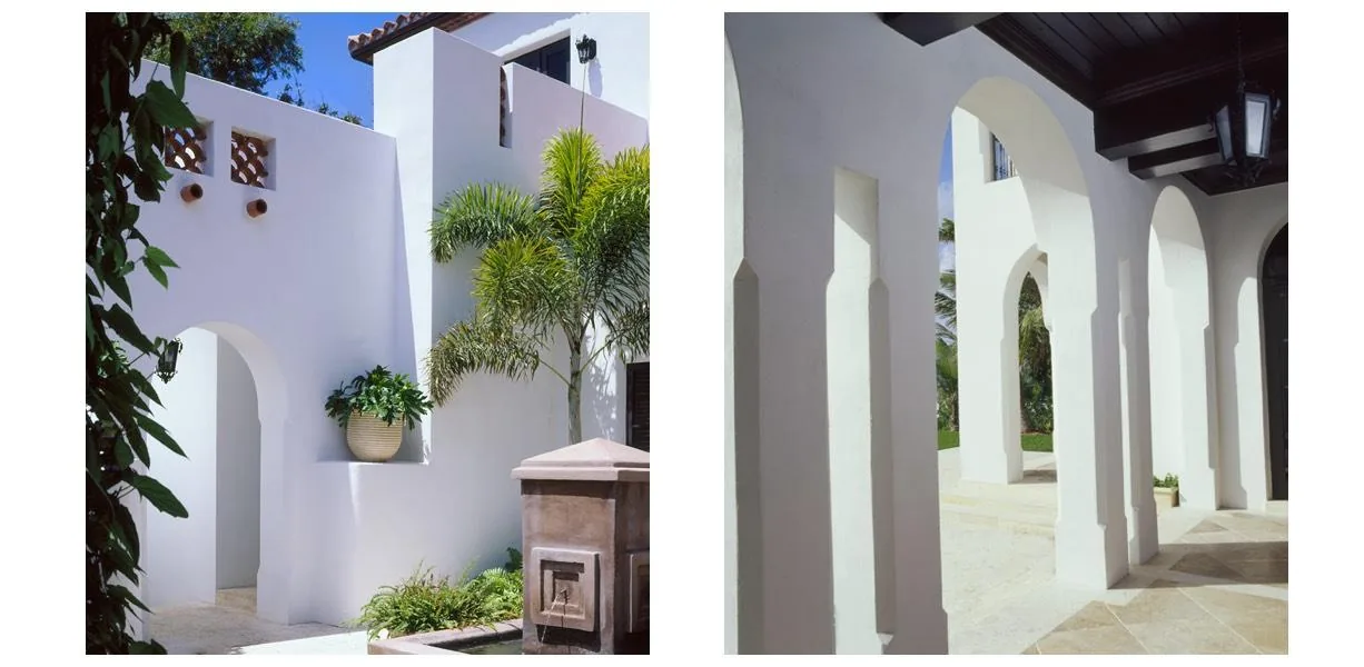 North Bay Road Residence #2 features white stucco walls with arched openings and a courtyard design.