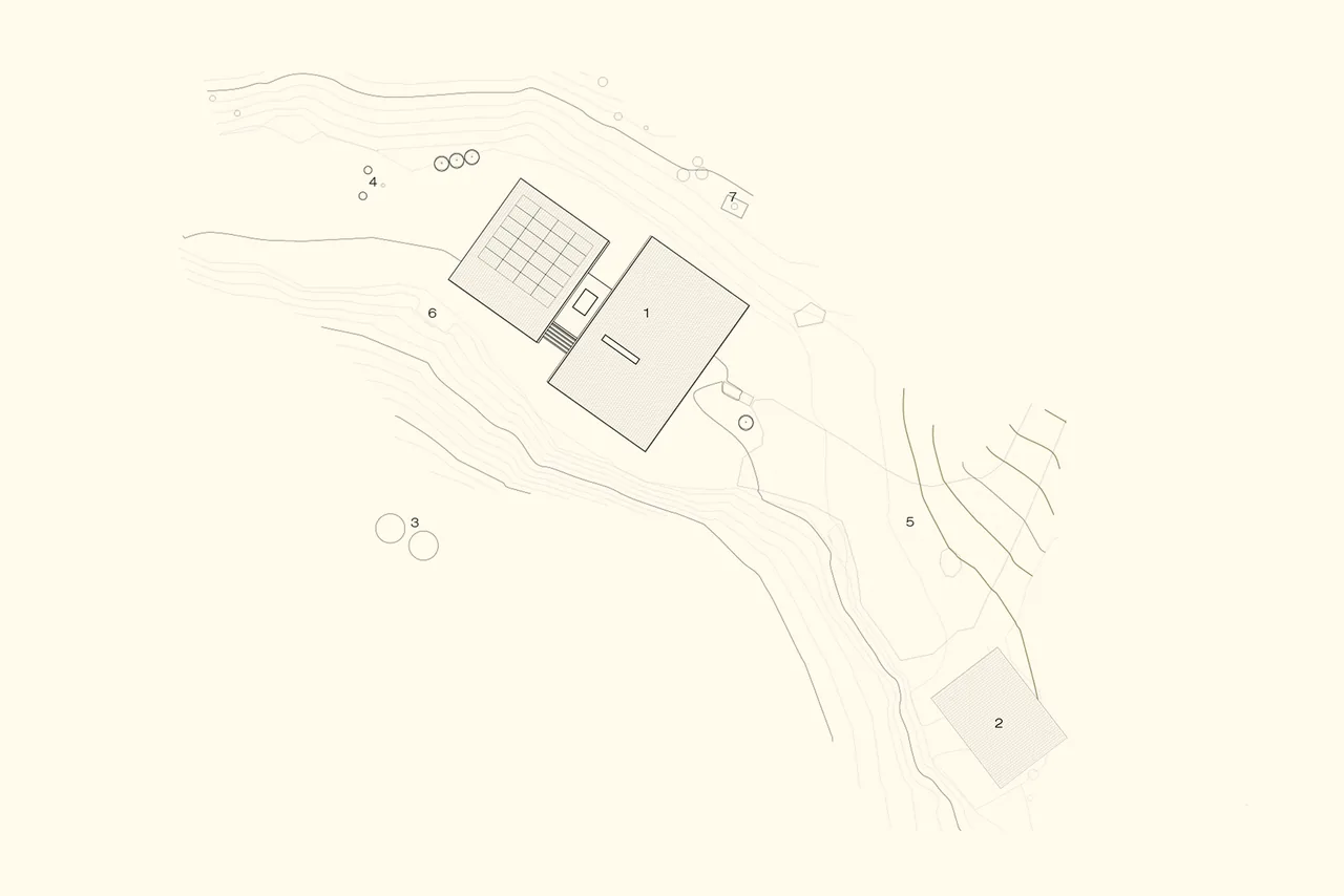 Site plan showing layout of buildings and topography with numbered features.