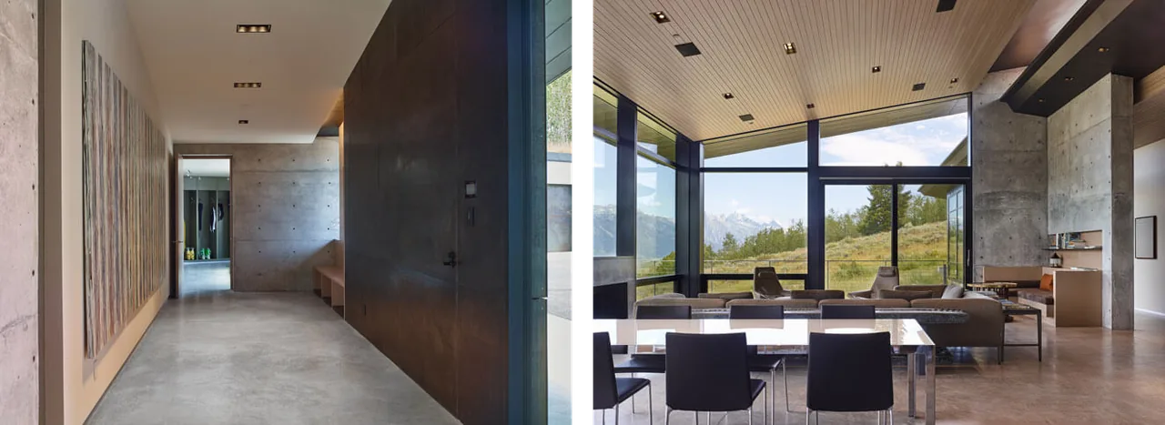 Interior hallway and open living-dining space with floor-to-ceiling glazing and concrete walls in the Wyoming Residence.