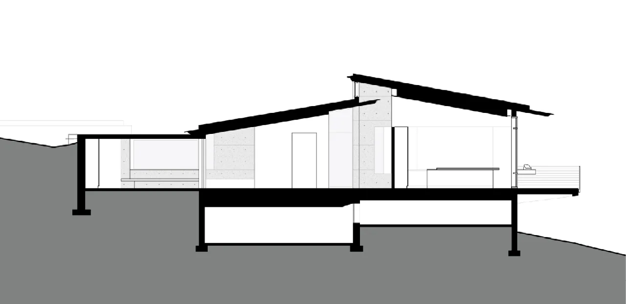 Section drawing of Wyoming Residence by Abramson Houses showing sloping site and shed roofs.