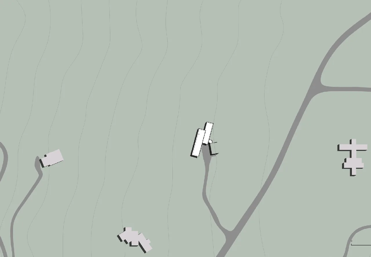 Site plan of Wyoming Residence by Abramson Houses illustrating building placement on a sloping grassland site.