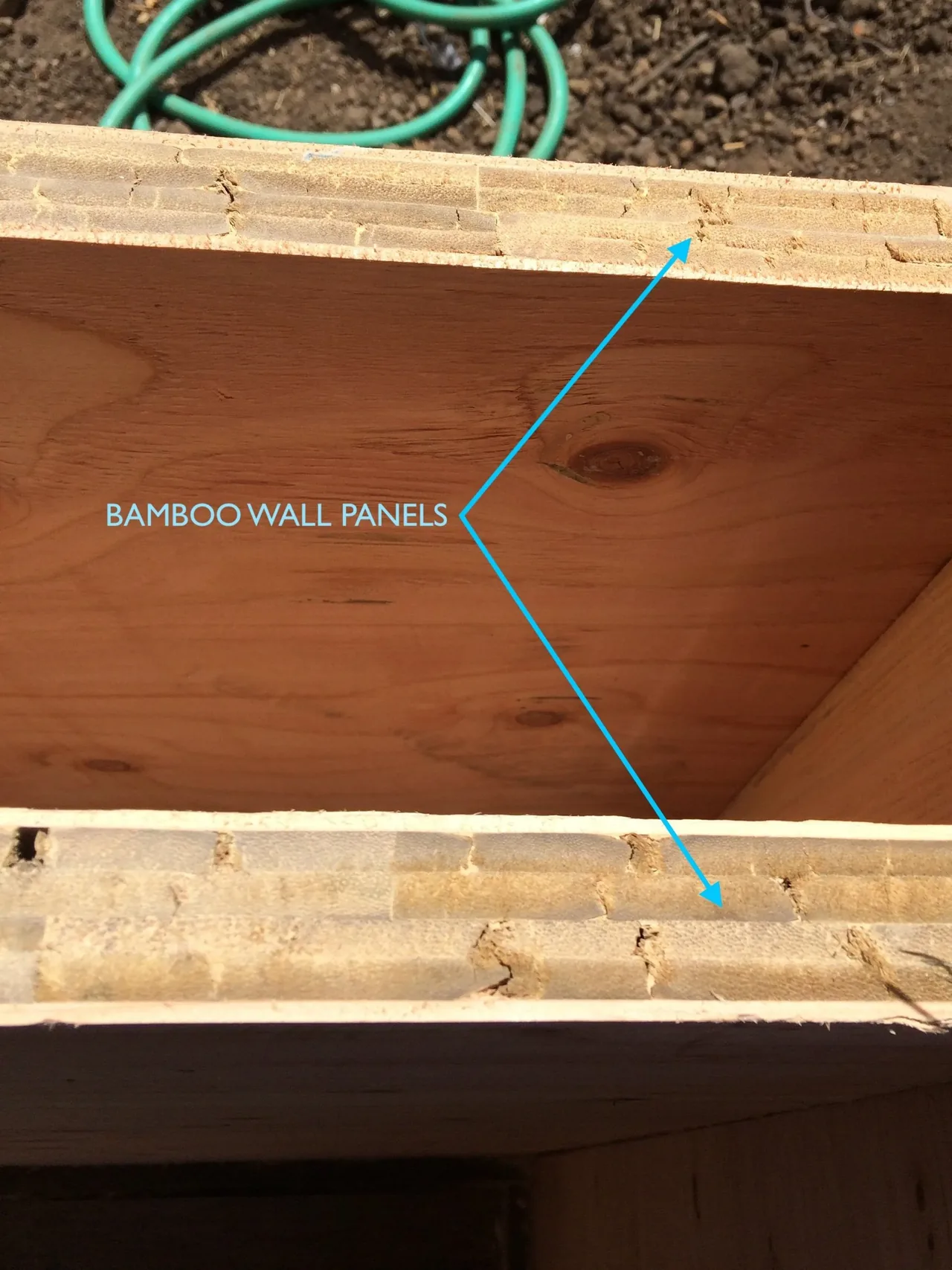 Detail of bamboo wall panels used in construction, highlighting the layered bamboo material.