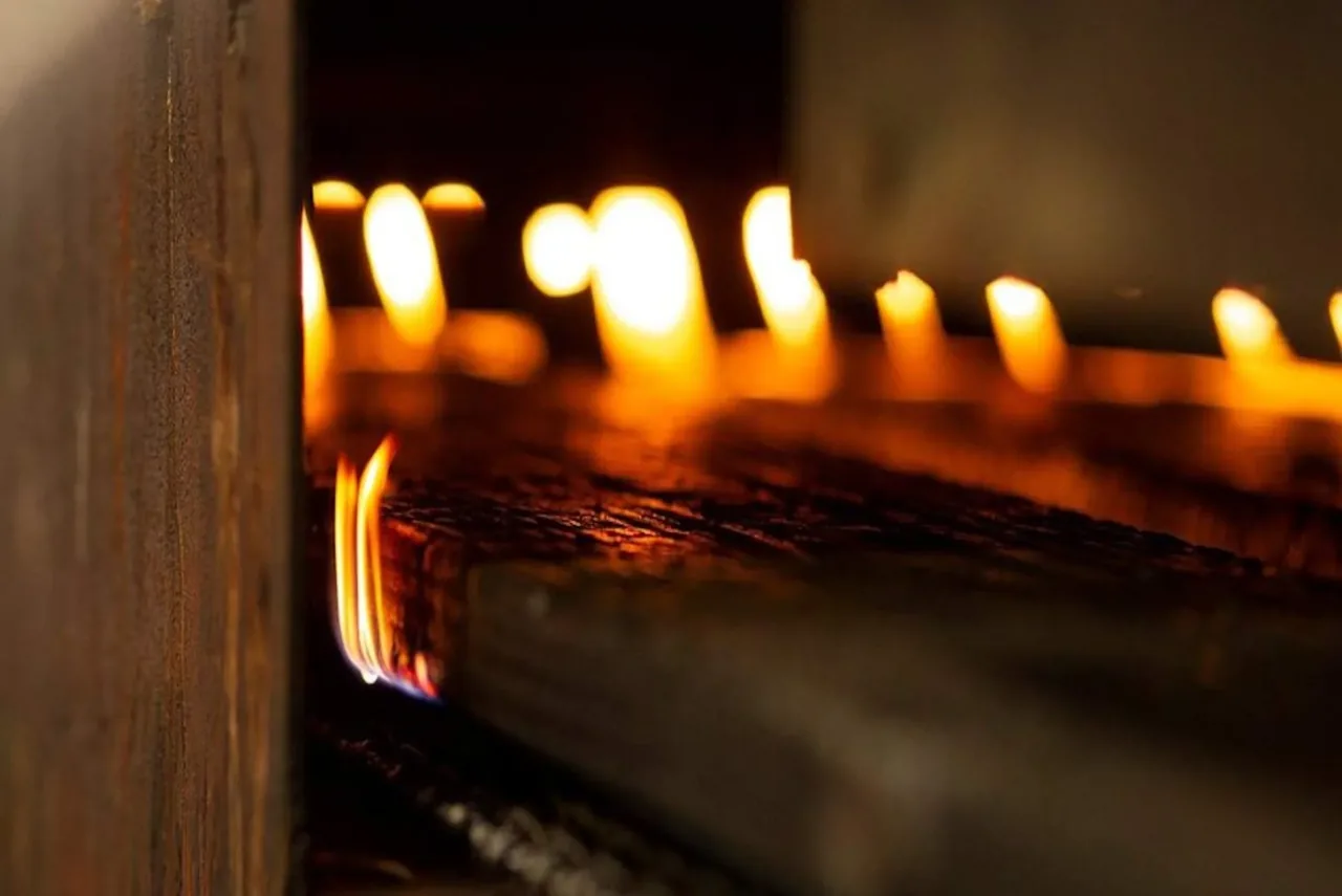 Detail of wood charring process used in Shou Sugi Ban technique for the house facade.
