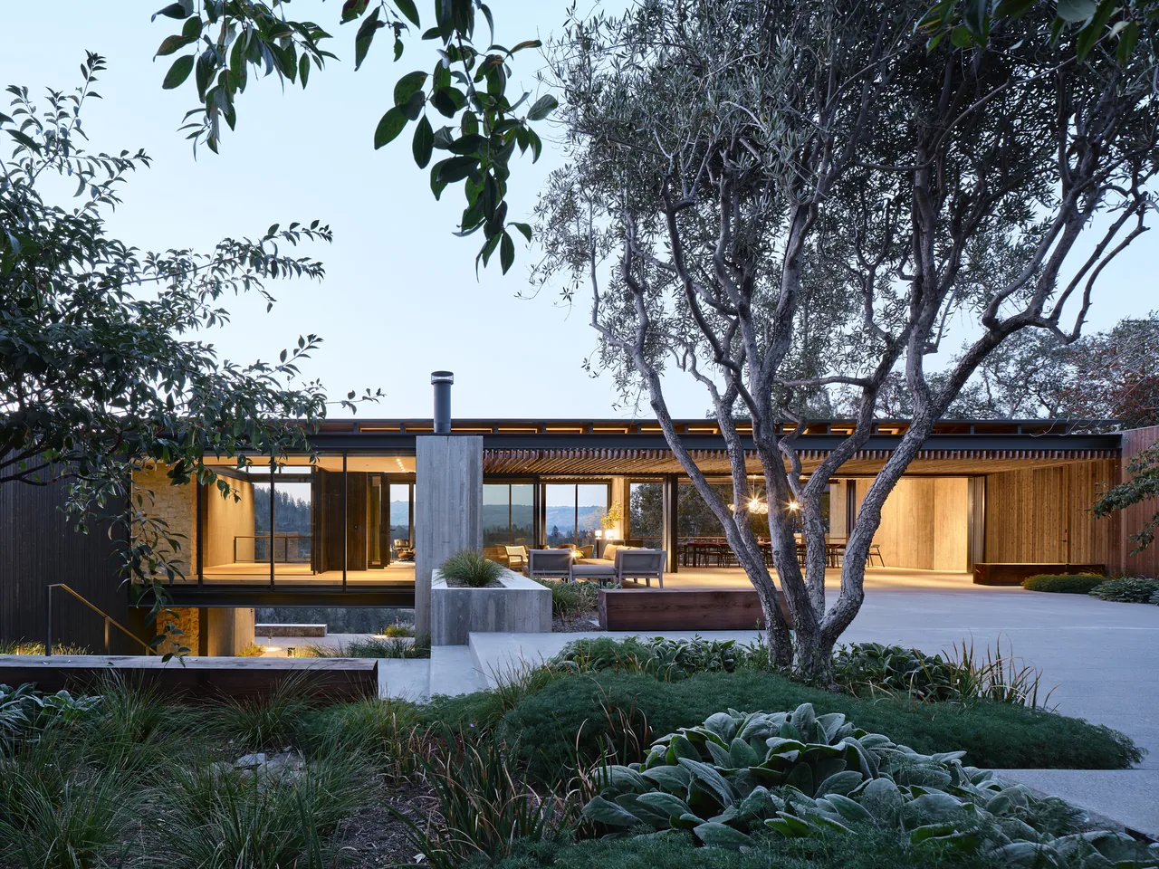 Trestle Residence by Aidlin Darling Design features floor-to-ceiling glazing and a flat roof overlooking hillside mountain views.