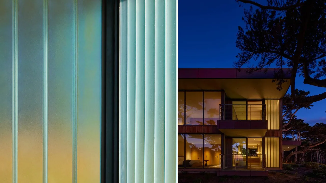 The Dogleg Residence by Lundberg Design features a modern exterior with floor-to-ceiling glazing and a balcony at dusk.