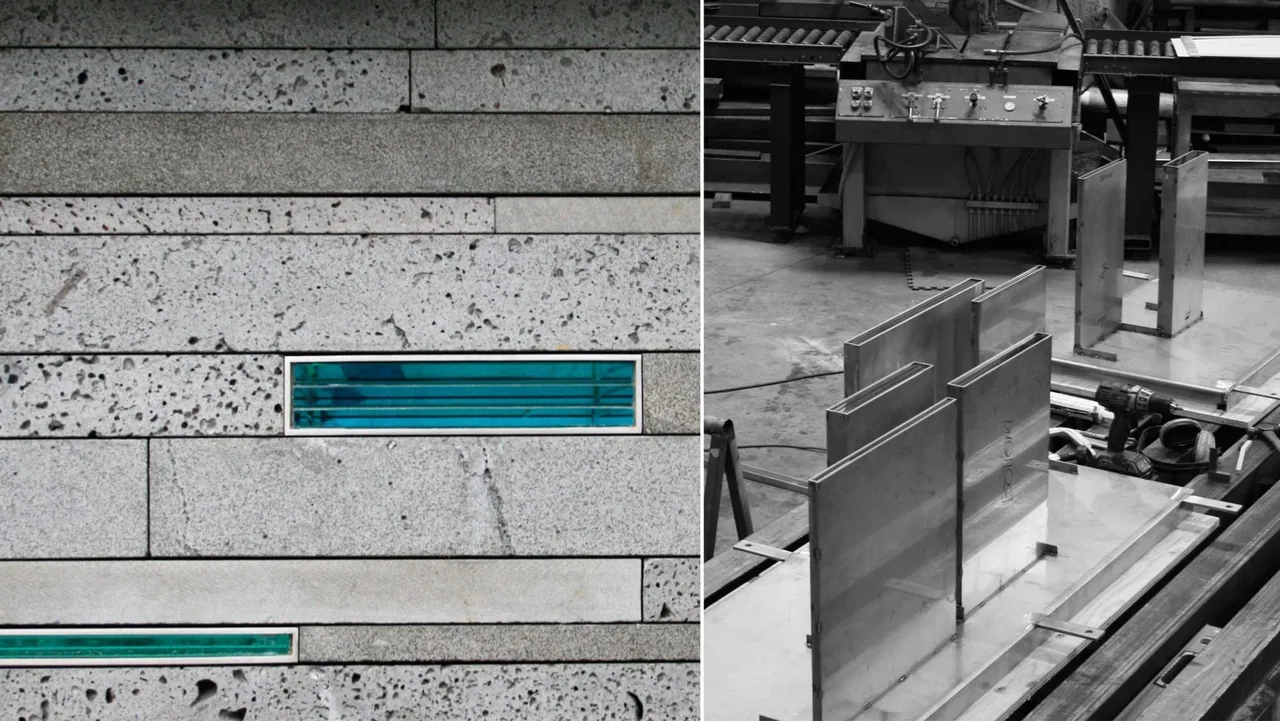 The image shows a textured concrete wall with narrow horizontal glass inserts and a workshop metal fabrication area.