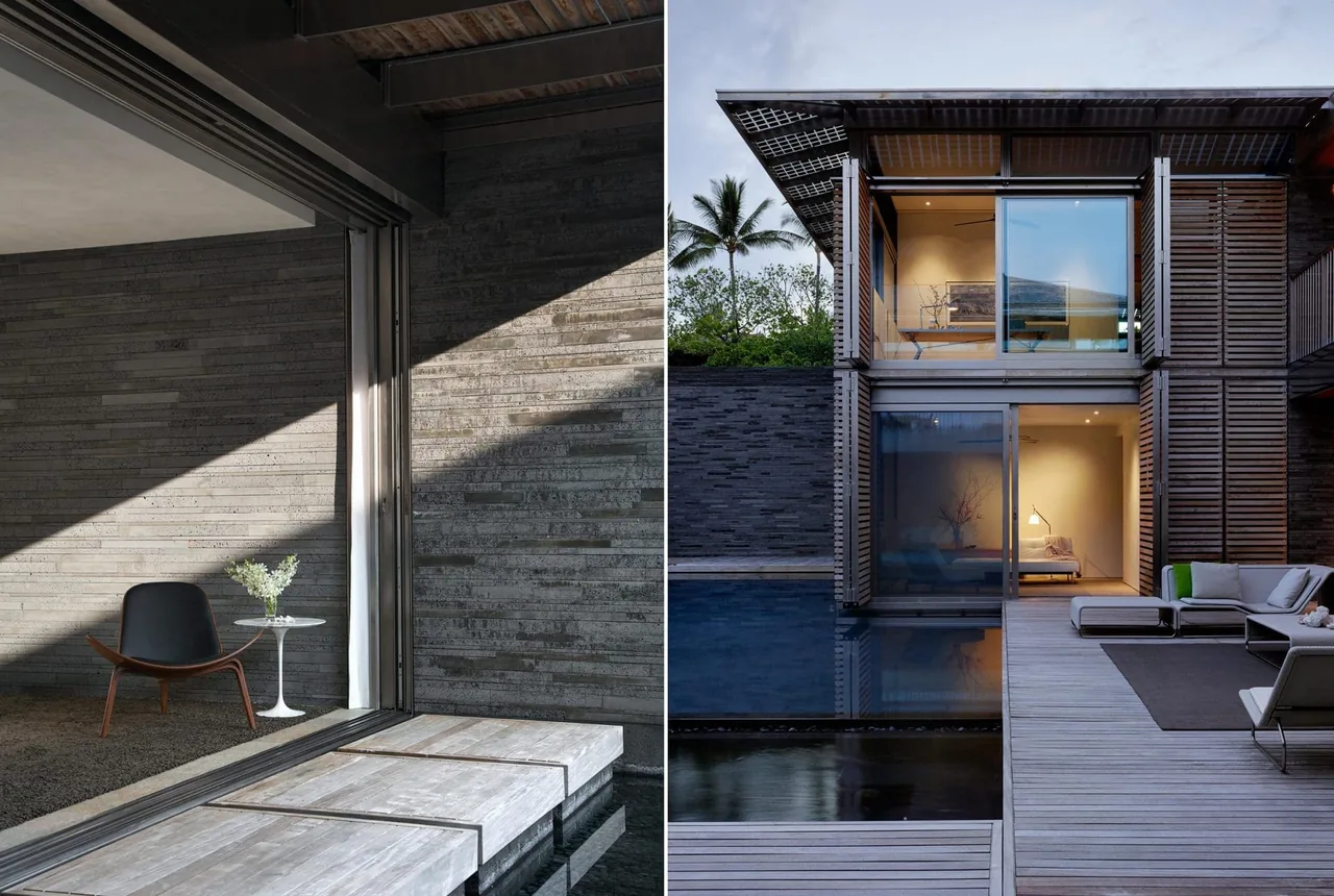 A modern residence with concrete plank walls, overhanging metal roof, and sliding glass doors opening to a pool and deck.