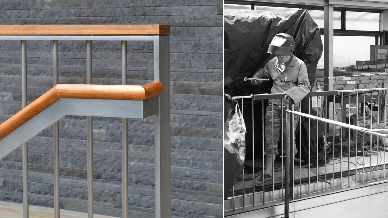 Close-up of a metal stair railing with wood handrail next to a board-formed concrete wall.