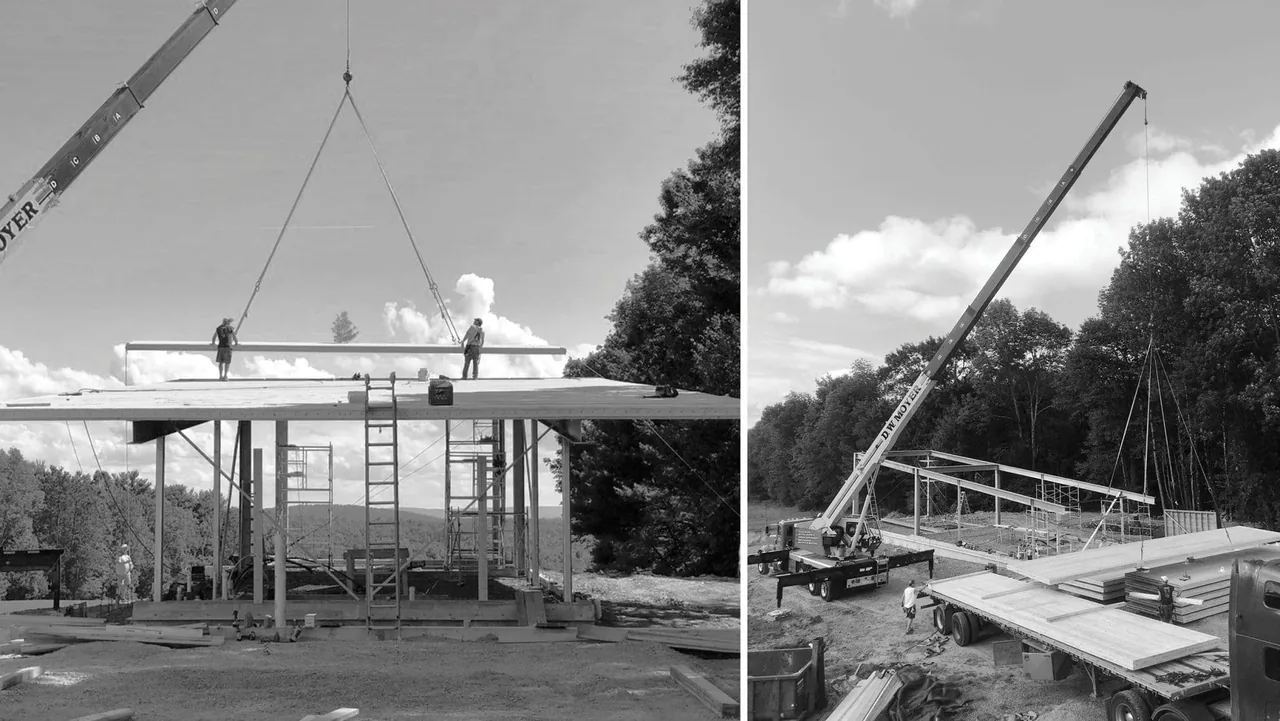 Construction progress of the Flying Dollar Residence shows cranes lifting roof panels and steel framework being erected.