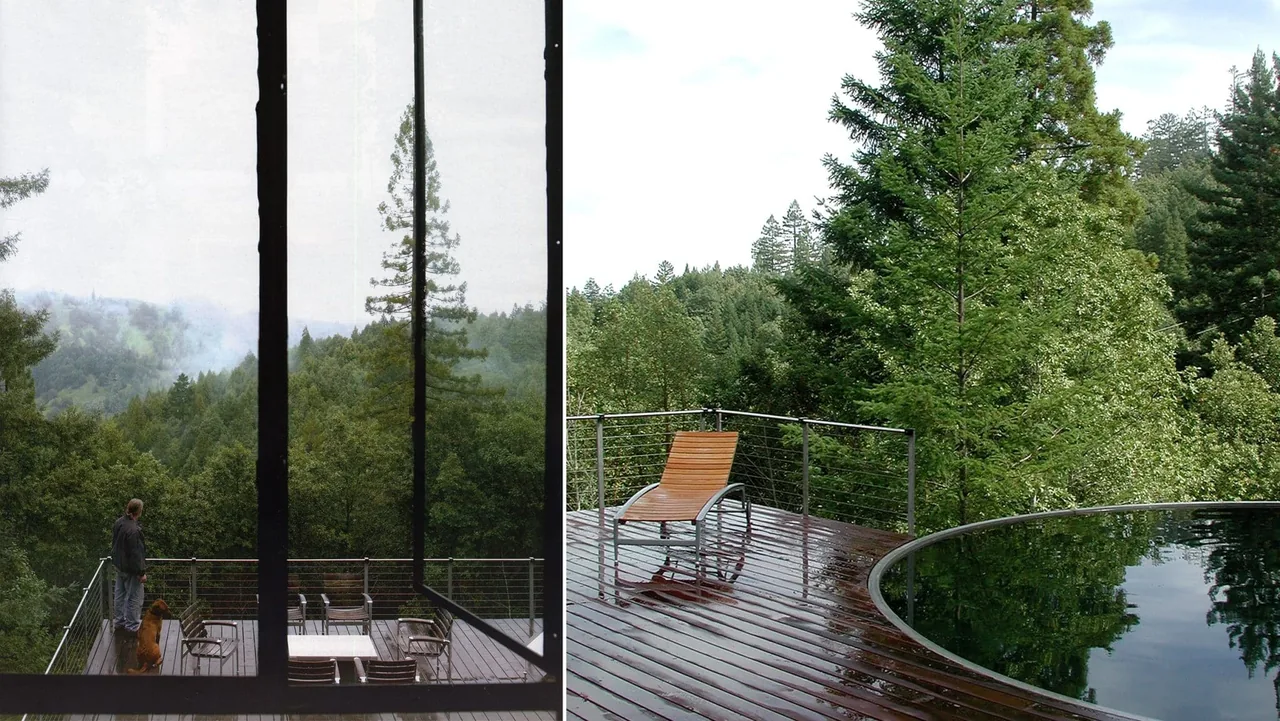 Outdoor living area of Lundberg/Breuer Cabin featuring a circular water feature and metal railing with a wooden lounge chair on a wet wood deck.