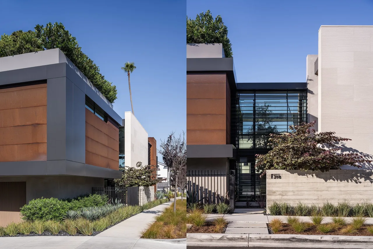 Goldenrod House exterior showing rust-colored metal panels, concrete walls, and landscaped front yard with planted rooftop visible.