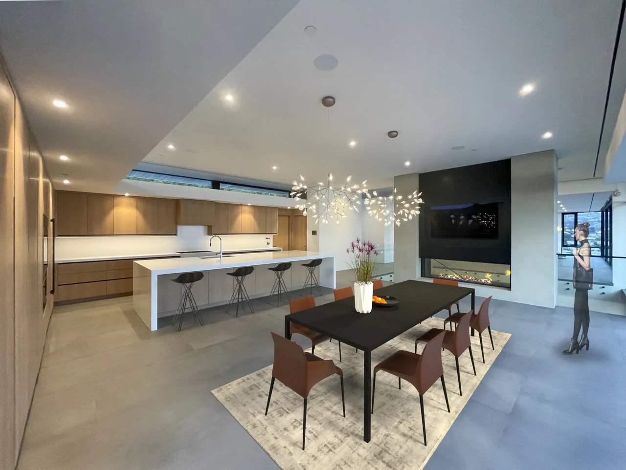 Modern kitchen and dining room with a large wooden cabinetry wall, white island, and black dining table with brown chairs