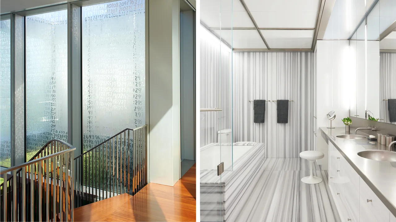 View of a stair landing with frosted, numbered glass panels and a bathroom featuring striped stone surfaces and metal fixtures