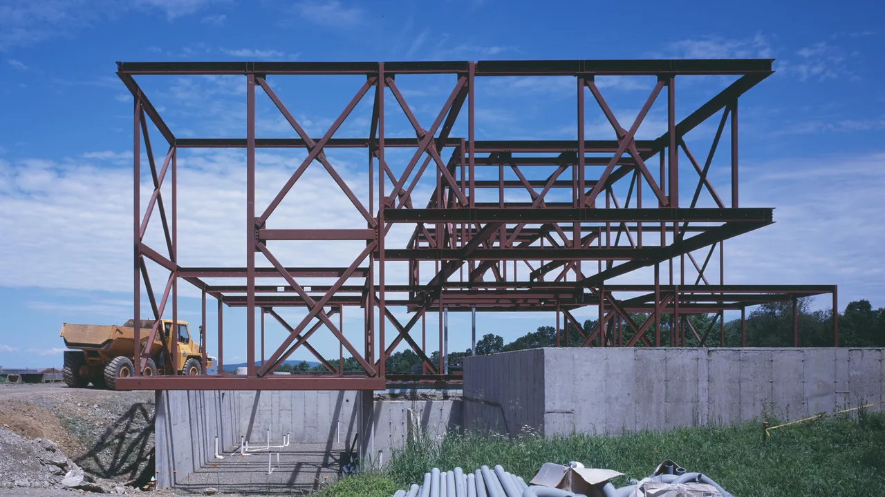 Construction site showing steel framing on concrete foundation for Dutchess County Residence Main House.