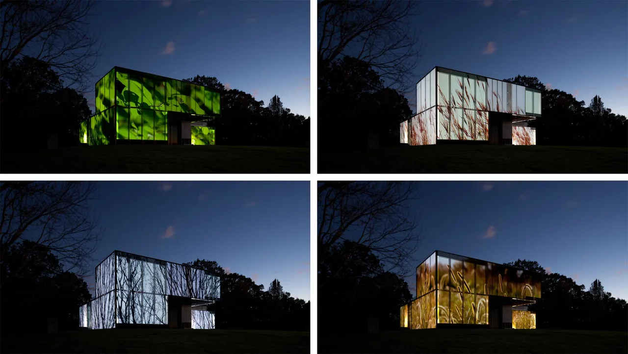Dutchess County Residence Main House features illuminated glass exterior panels that display changing nature-inspired imagery at night.