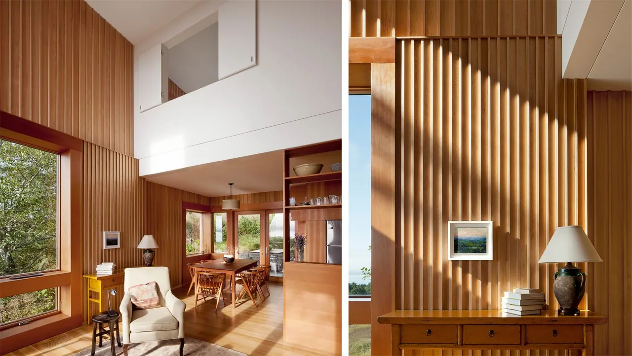 Neskowin Beach House interior shows vertical wood paneling and expansive windows with natural light.