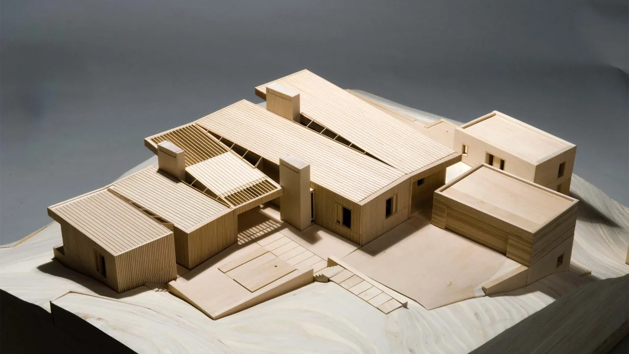 Architectural model of Portland Heights Residence showcasing multiple connected structures with flat and gable roofs.