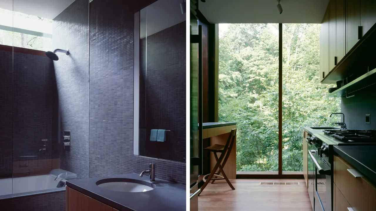 Interior views showing a tiled gray bathroom with a bathtub and a kitchen with large vertical wood-framed windows overlooking greenery.