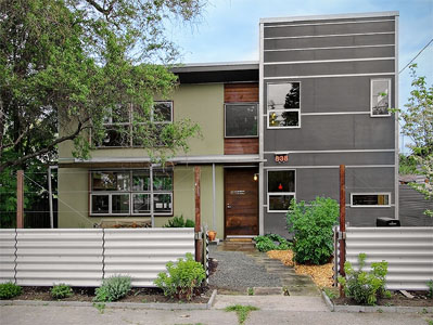 Modern two-story home on Donovan Street with horizontal window bands and mixed siding.