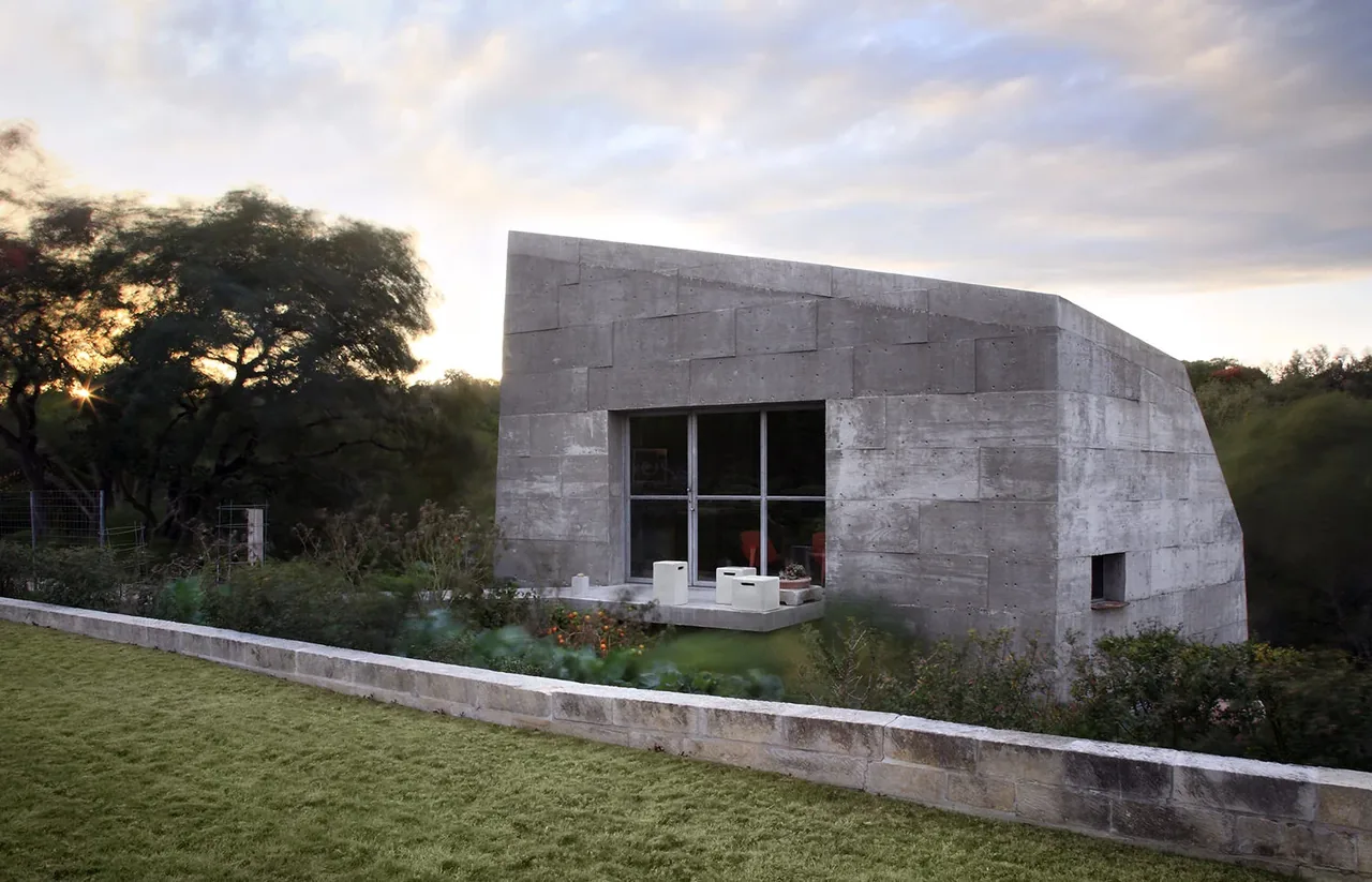 Concrete Studio Gallery features textured concrete walls and rectangular windows in an Austin setting.