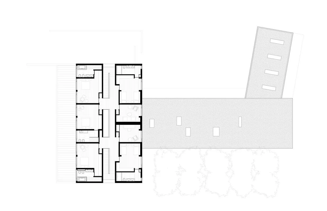 Floor plan of the Watermill Residence displaying bedroom suites arrayed along a central corridor with exterior patios.
