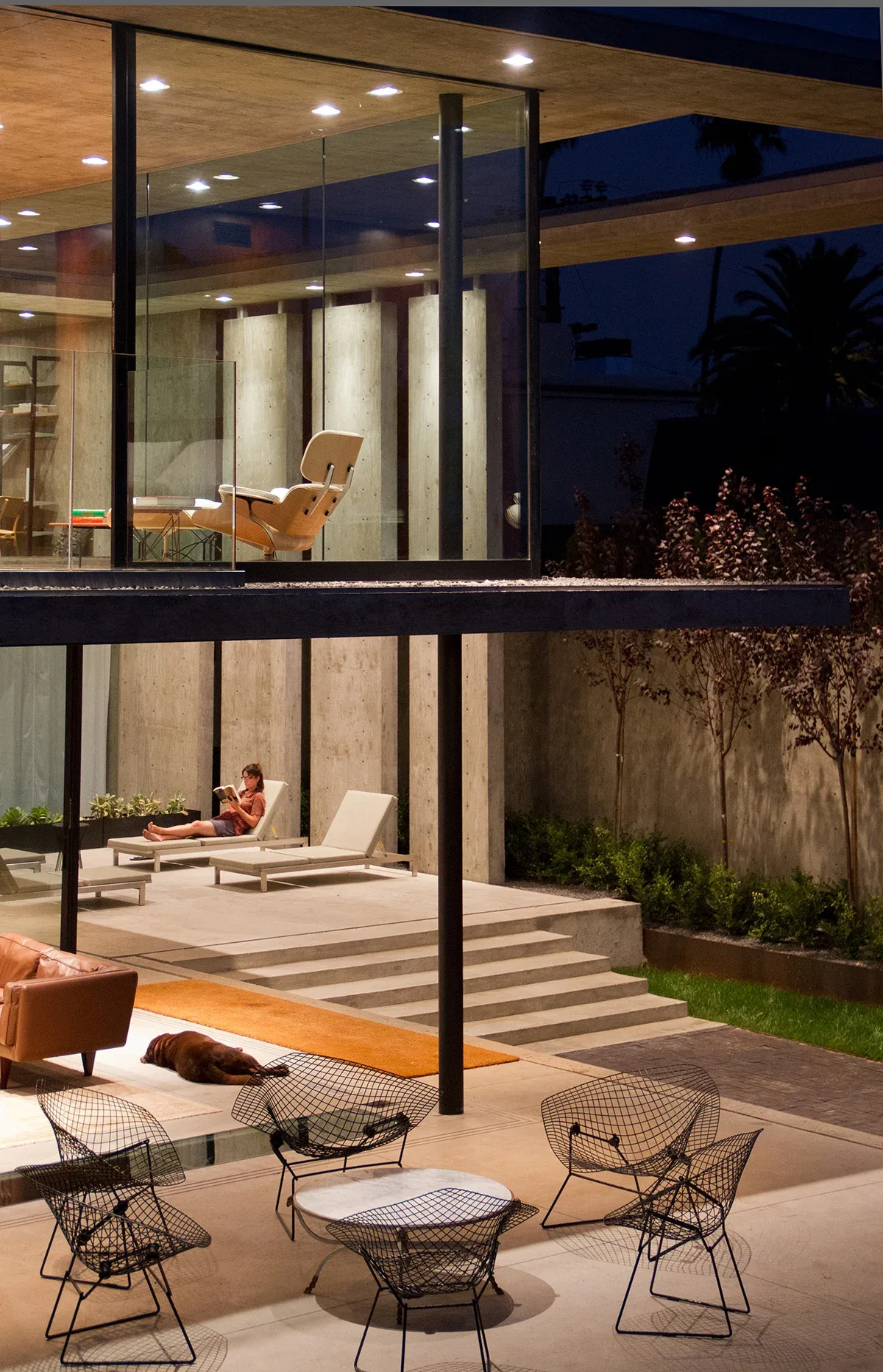 The Cresta features exposed concrete columns and glass walls with outdoor seating areas visible.