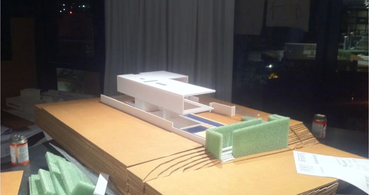 Model of The Cresta project featuring a modern rectangular house on layered terrain.