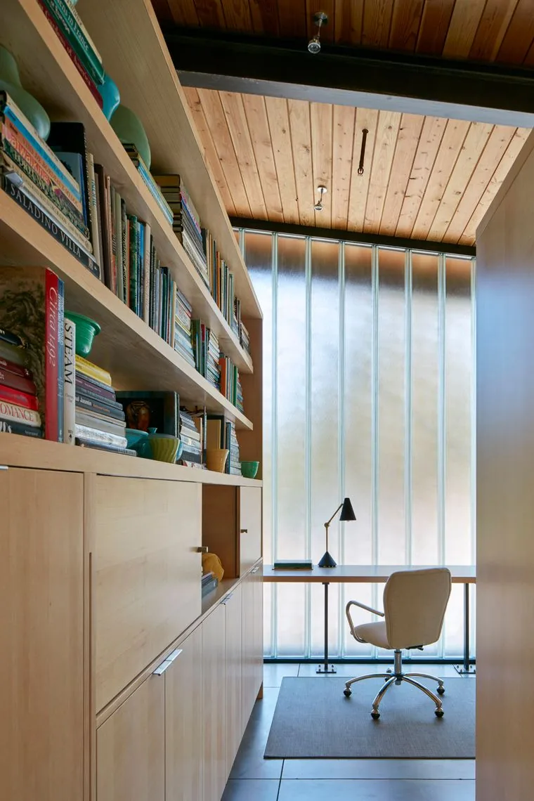 Home office room with large frosted glass window wall and wood-paneled ceiling at Split Rock Springs Ranch.