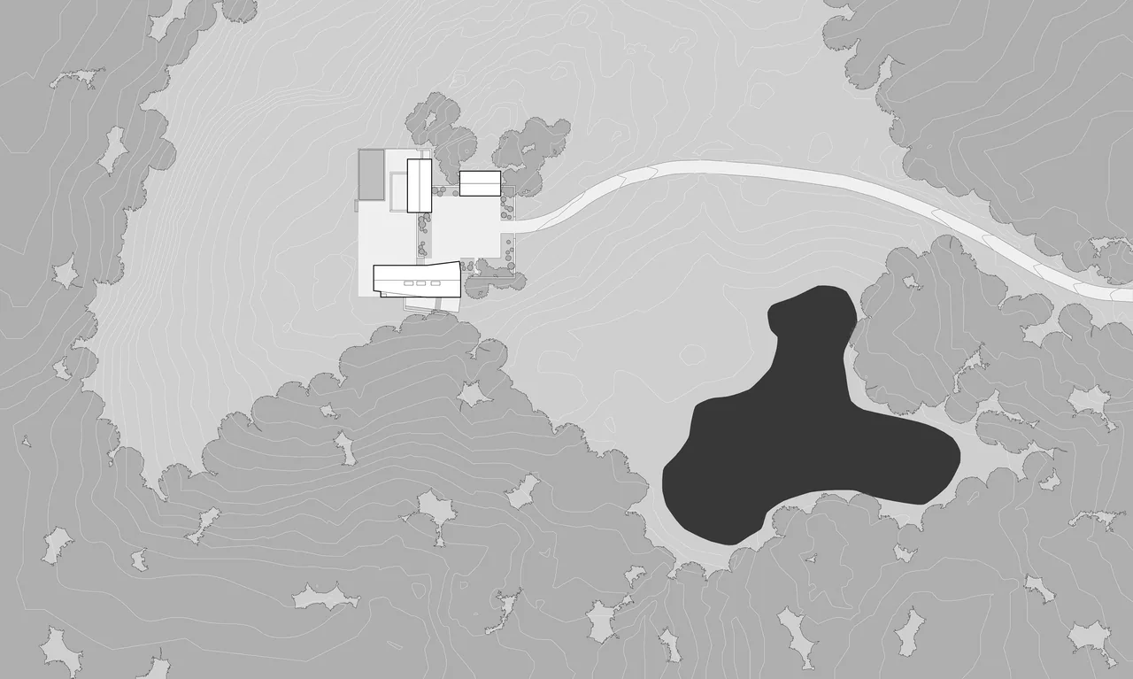 Site plan of Blue Rock House featuring the building, driveway, pond, and surrounding landscape.