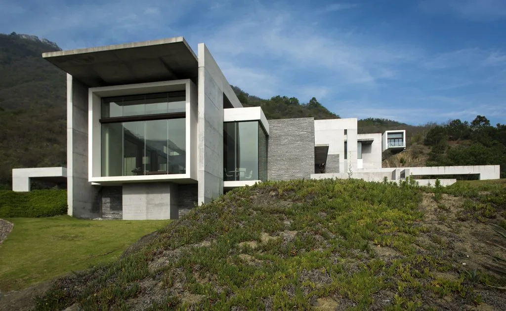 House near Monterrey by Surber Barber Choate & Hertlein Architects features modern concrete construction and large glazing.