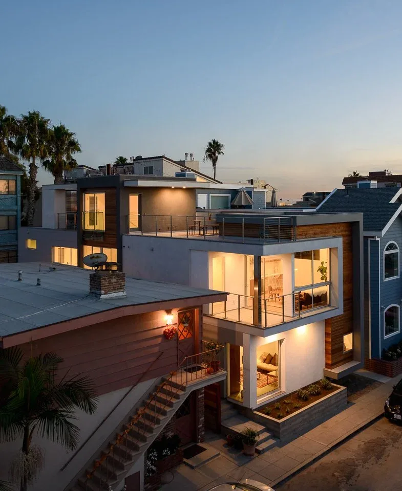 The 61ST project showcases a modern multi-story home with extensive glass elements, terraces, and mixed materials in Los Angeles.